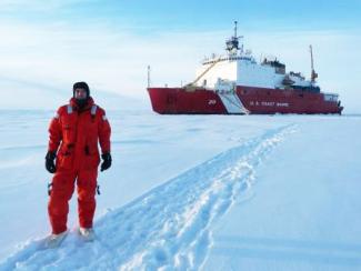 Chris Marsay at the North Pole in front of the US Coast Guard Cutter Healy